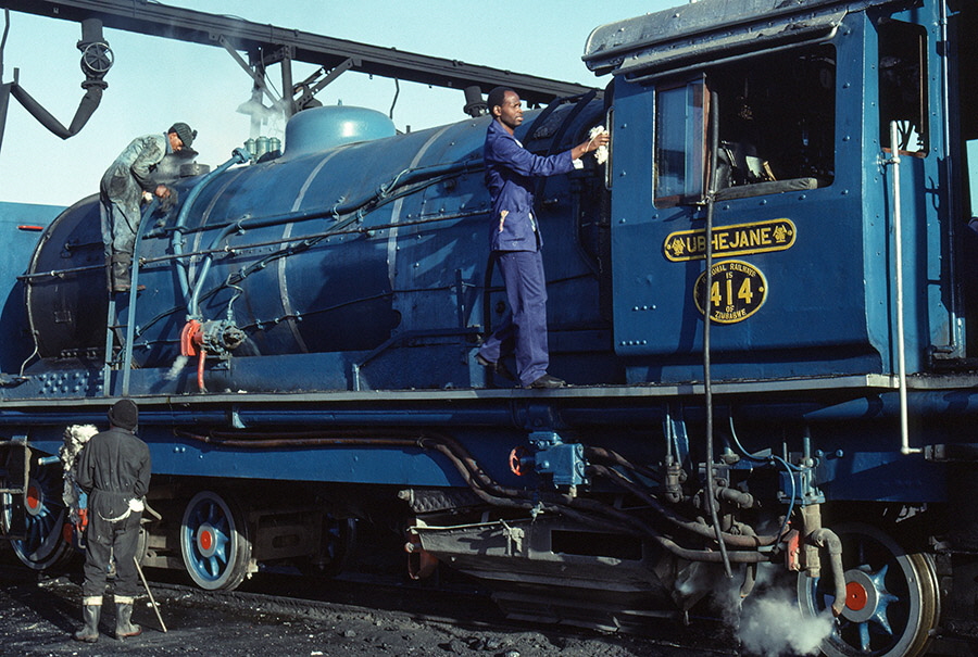 National Railways of Zimbabwe class 15A 4-6-4+4-6-4 'Garratt' steam locomotive no. 414 'Ubhejane' being cleaned at Bulawayo locomotive shed, Zimbabwe