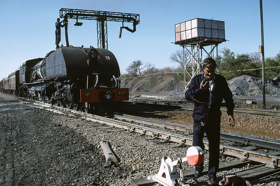 NRZ 15A class 4-6-4+4-6-4 'Garratt' steam locomotive no. 407 'Ukhozi' ('Eagle') between Bulawayo and Victoria Falls, Zimbabwe, with Dave Putnam