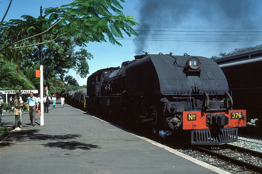 NRZ 15A class 4-6-4+4-6-4 'Garratt' no. 376 'Ingulungundu' passing through Victoria Falls station, Zimbabwe, with a freight train for Zambia