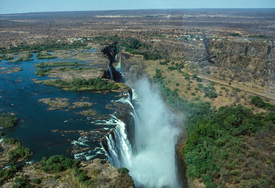 Aerial photograph of Victoria Falls with a train on the bridge