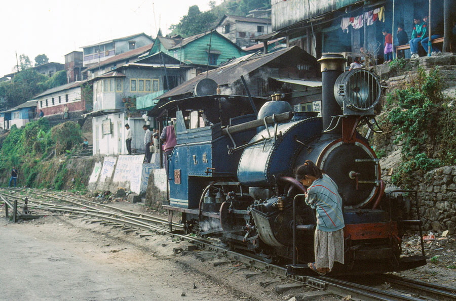 Darjeeling Himalayan Railway narrow gauge steam locomotive, class B 0-4-0ST no. 805 reverses to replace the engine on a passenger train heading up the mountain to Darjeeling, India,