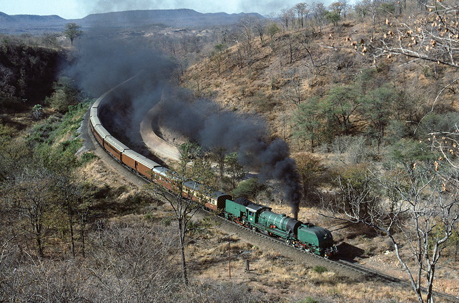 NRZ 16A class 2-8-2+2-8-2 'Garratt' no. 612 performs a run-past with the 'Union Limited Zambezi tour train just south of Hwange, Zimbabwe