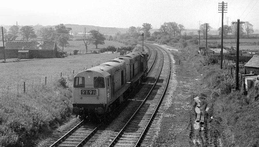 English Electric type 1 Bo-Bo, 8042 and 8192, propel a brake van southwards at Bagworth, Leicestershire