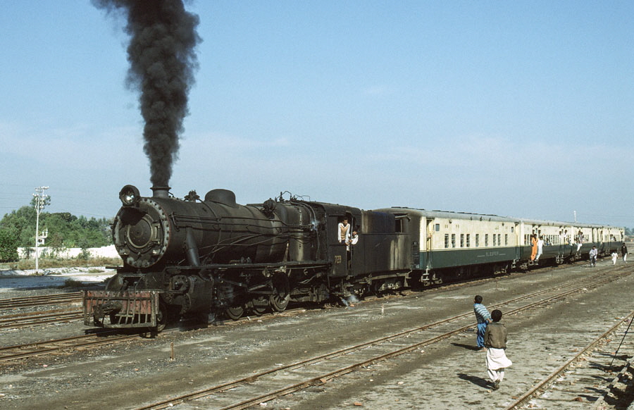 Oil fired, meter gauge, class YD 2-8-2 729 at Kot Ghulam Muhammad, Pakistan, with a train from Mirpur Khas
