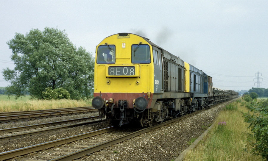 Class 20 Bo-Bo diesel locomotives nos. 20132 & 20054 with a ballast train head north on the Midland Main Line south of Loughborough