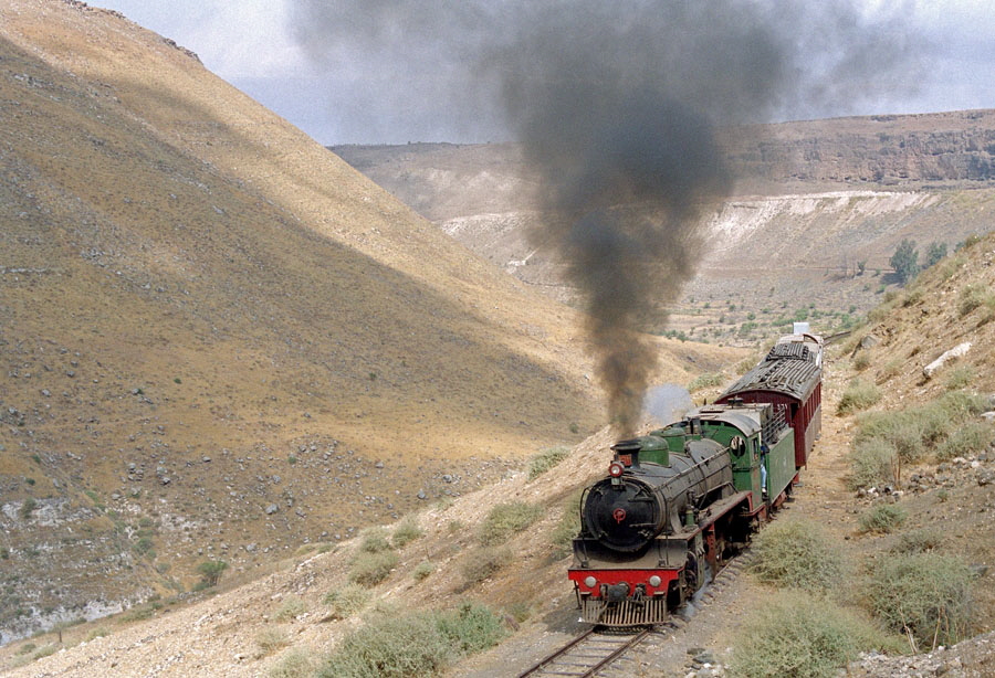 Steam locomotive with train at Yarmuk Gorge, Hedjaz Railway, Syria