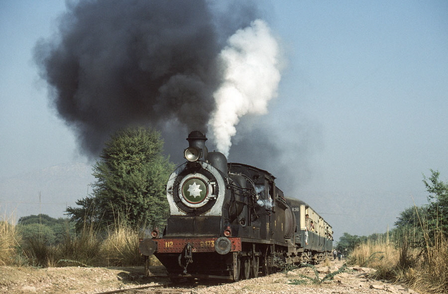 Broad gauge, oil fired, steam locomotive on a passenger train between Gharibwal and Malakwal station, Pakistan, 21st December 1993