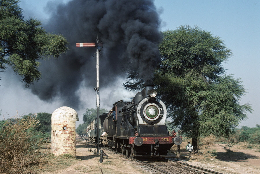 Broad gauge, oil fired, steam locomotive departs Haran Pur station, Pakistan, 21st December 1993