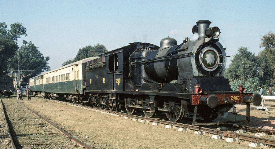 Broad gauge, oil fired steam locomotives, class SGS 0-6-0 2410 at Malakwal station, Pakistan, 22nd December 1993