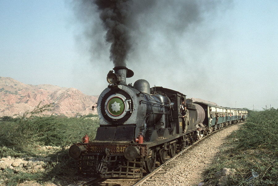 Broad gauge, oil fired steam locomotives, class SGS 0-6-0 2465 approaching Khewra, Pakistan, 22nd December 1993