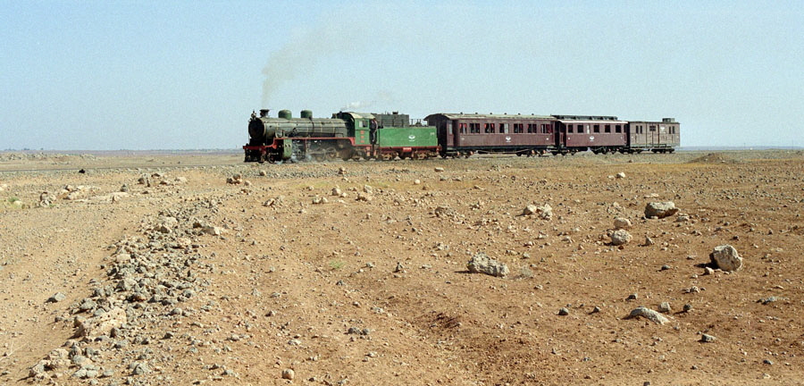 Steam train in desert between Bosra & Dera'a, Hedjaz Railway, Syria