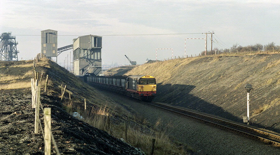 Class-58 with train loading coal at Coalfield Farm loader, near Coalville