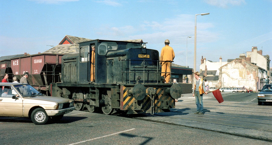 NCB Barclay 0-6-0 diesel shunting locomotive crossing over North Terrace, Seaham