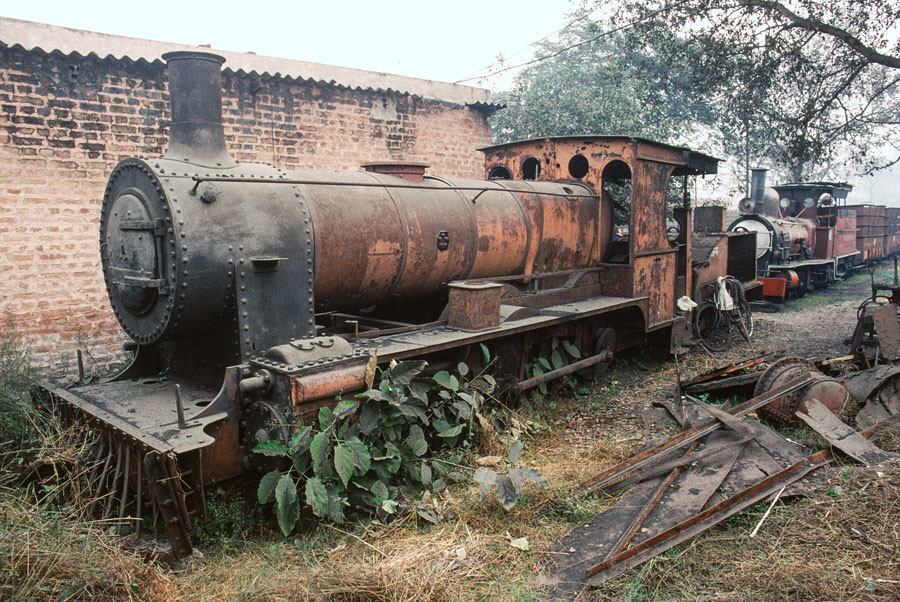 Derelict metre gauge steam locomotive 4-4-0 no. 3, built by Dübs of Glasgow in 1883, at Saraya Sugar Mills India, 28th December 1993