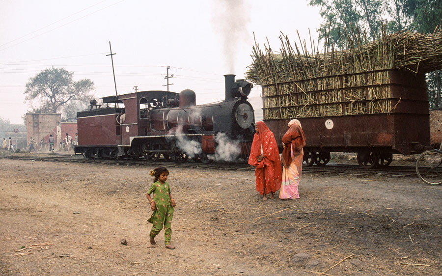 Metre gauge 4-4-0 no. 5, built by Vulcan Foundry in 1884, arrives at Saraya Sugar Mills, India, with a load of sugar cane from the fields, 28th December 1993