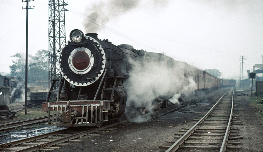 Metre gauge class YG 2-8-2 departs from Gorakhpur, India, with an evening train, 28th December 1993
