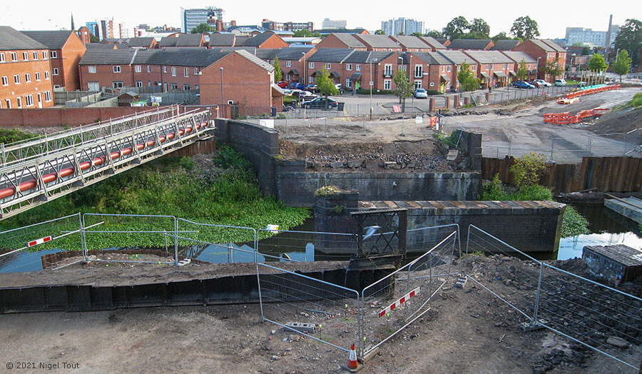 Dwellings built on the scrapyard, railway bridge removed